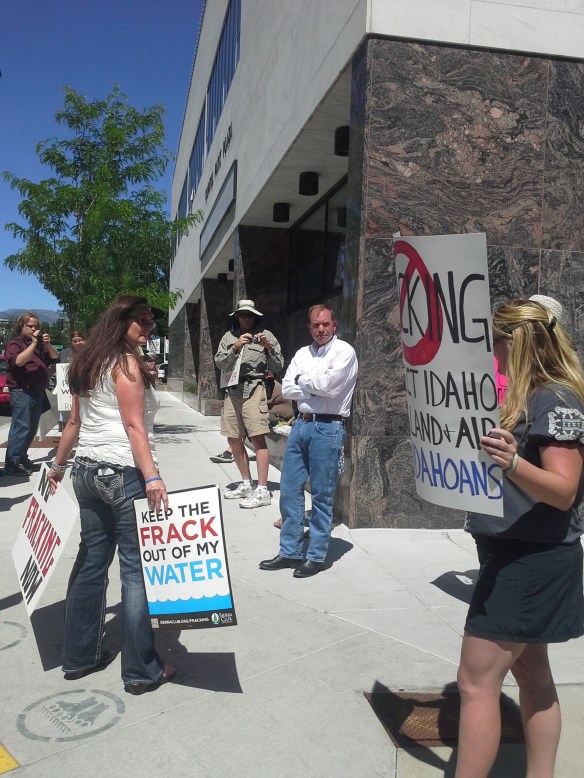 Stop the Frack Attack, Idaho! in Boise, talking with Idaho Department of Lands director Tom Schultz (Helen Yost photo)