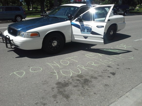 Stop the Frack Attack, Idaho! in Boise, drawing two cop cars of repression (Helen Yost photo)