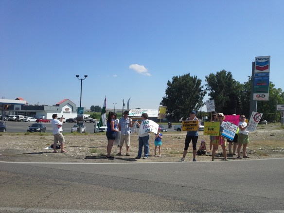 Protesters from across the state and country chant and wave fracking/drilling protest signs at the high-traffic corner of Highways 95 and 30 near Interstate 84 Exit 3 in southwestern Idaho.
