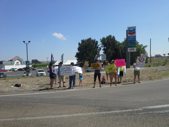 Protesters from across the state and country chant and wave fracking/drilling protest signs at the high-traffic corner of Highways 95 and 30 near Interstate 84 Exit 3 in southwestern Idaho.